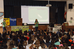 Esther Lindstrom Elementary students hear a presentation on the power of reducing, reusing and recycling from Grades of Green, an environmental education nonprofit that runs a contest for schools to reduce lunchtime trash. The November assembly helped excite students about Lindstrom’s participation in a two-year contest for a $1,000 grant.