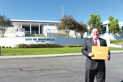 Federal Criminal Prosecutor Charles Pell holds his nomination papers in front of Montebello City Hall. Pell is running for Treasurer of the City.