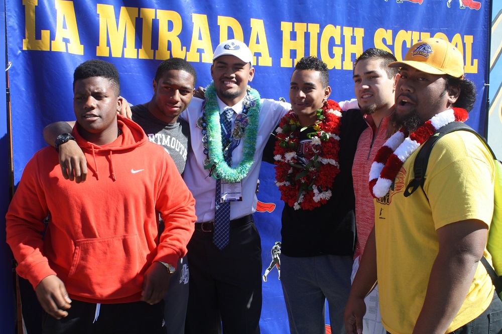 La Mirada High football Division III-AA State Championship teammates celebrate after signing official letters of intent. From L-R, Curtis Dixon, Micah Croom, Keanu Saleapaga, Tevaka Tuioti, Jared Enrico and Ty Faatoalia. 