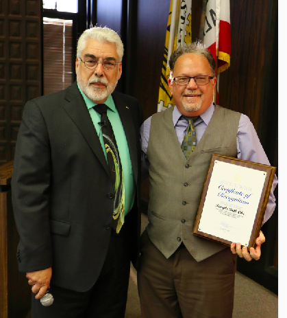 Mayor De Ruse presents Rabbi Mark Goldfarb of Temple Beth Ohr with a 60th anniversary recognition certificate at the August 23 City Council Meeting.